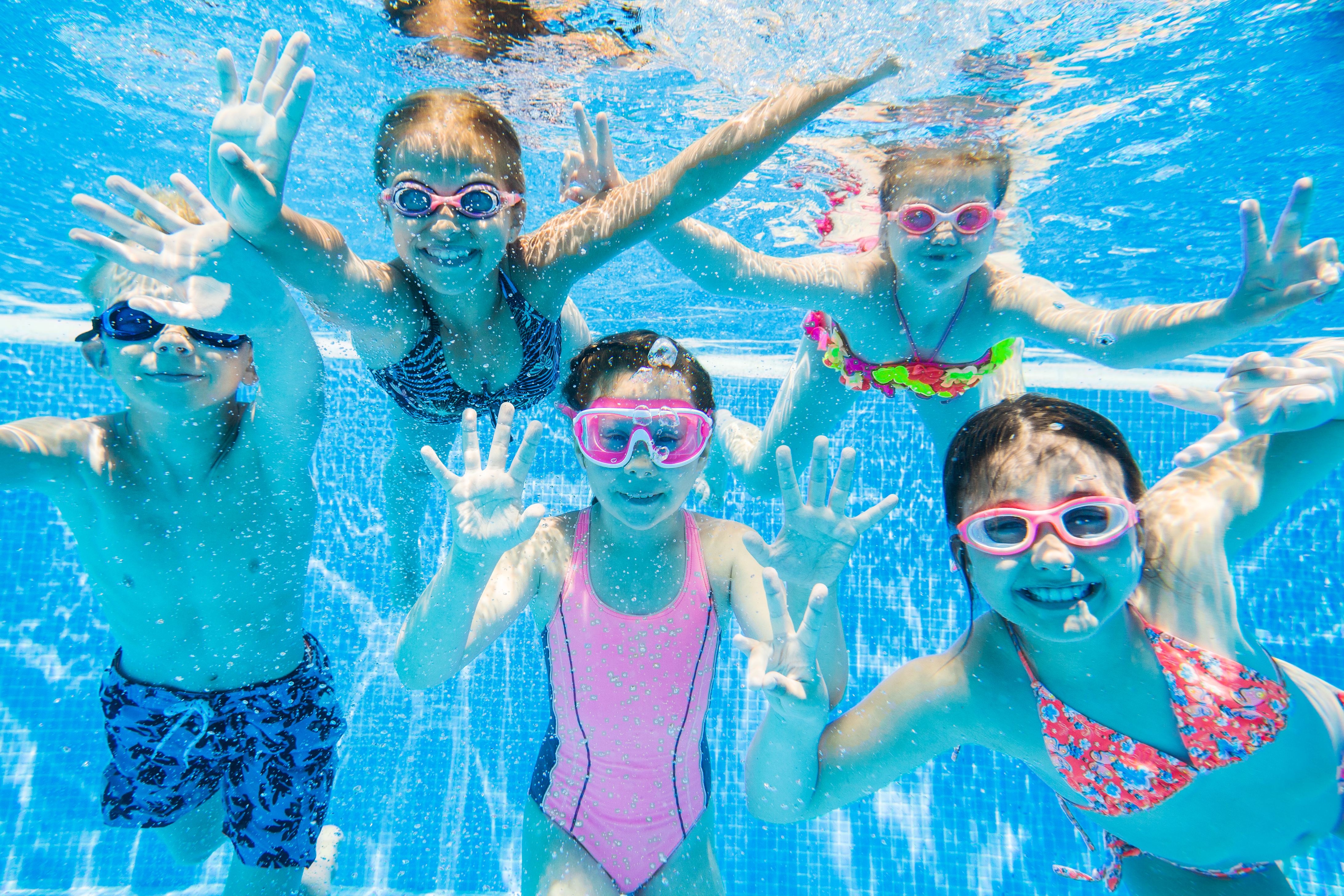 Kids enjoying swimming class in Dubai pool